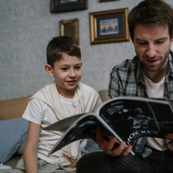 Man And Child Reading