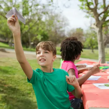 Child Throwing Paperplane